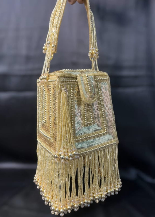 gold sequin tassel potli bag